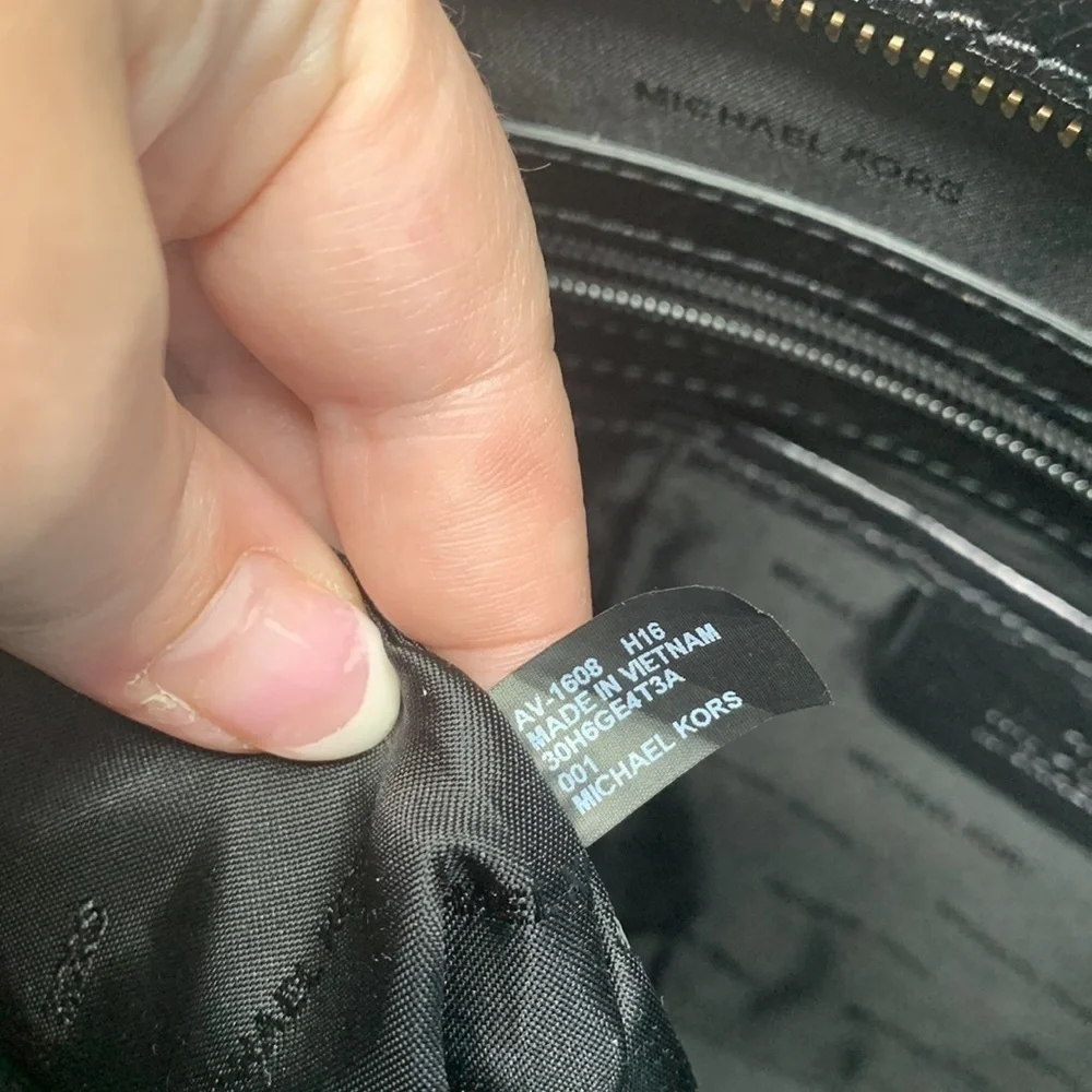 Michael Kors a black Vertical Tote.